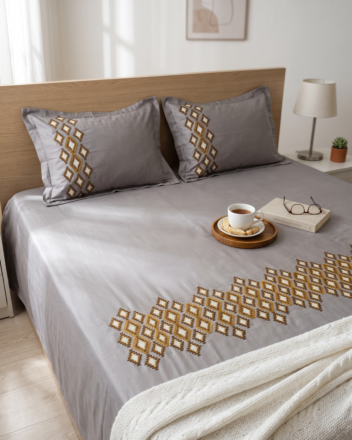 Heritage Diamond Weave grey cotton satin king bedsheet with embroidered pillow covers on bed